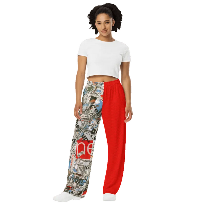 Woman wearing a white crop top and colorful, patterned pants with a red section.