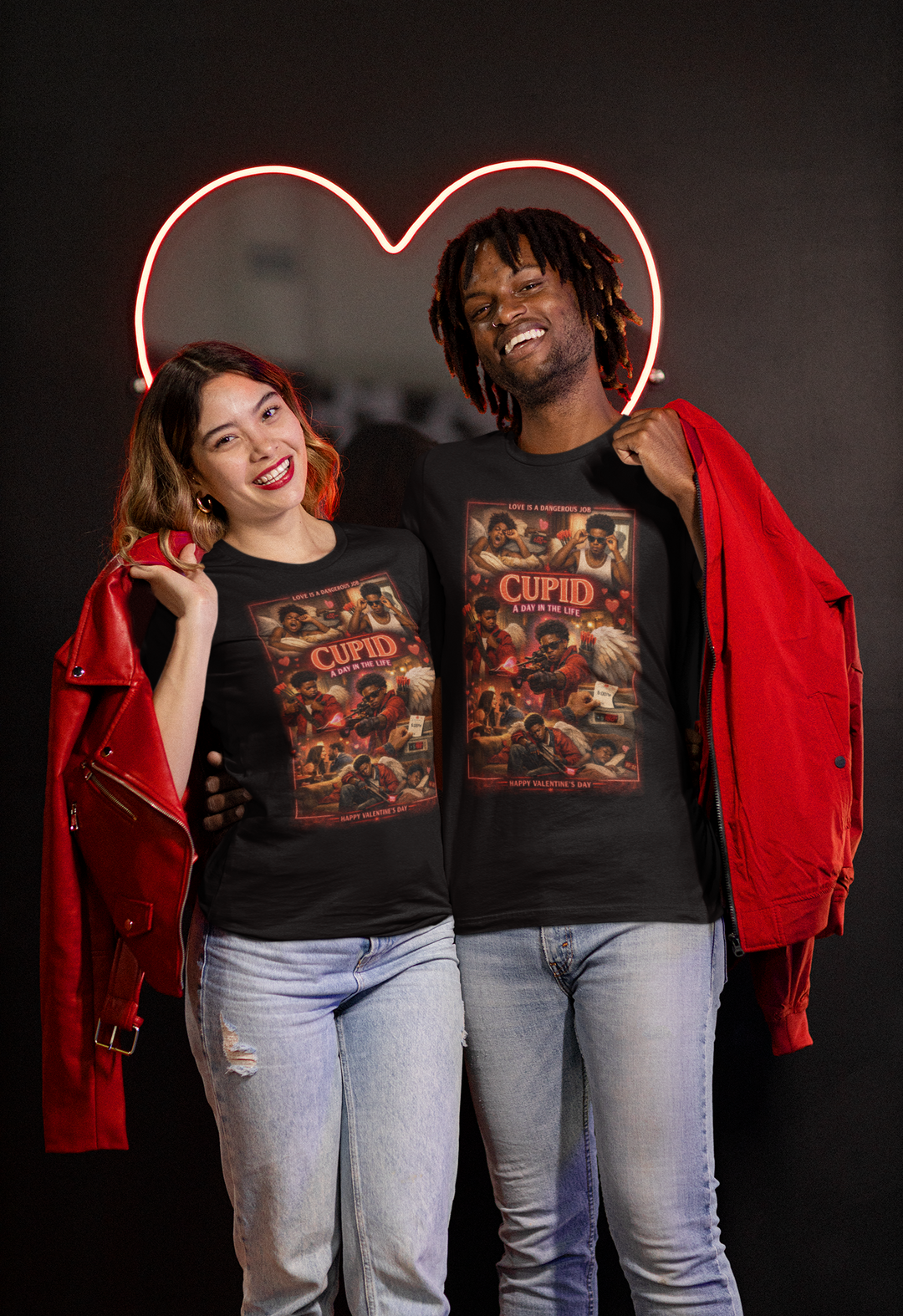 Two people wearing 'Cupid' t-shirts with a heart-shaped light behind them on a dark background.