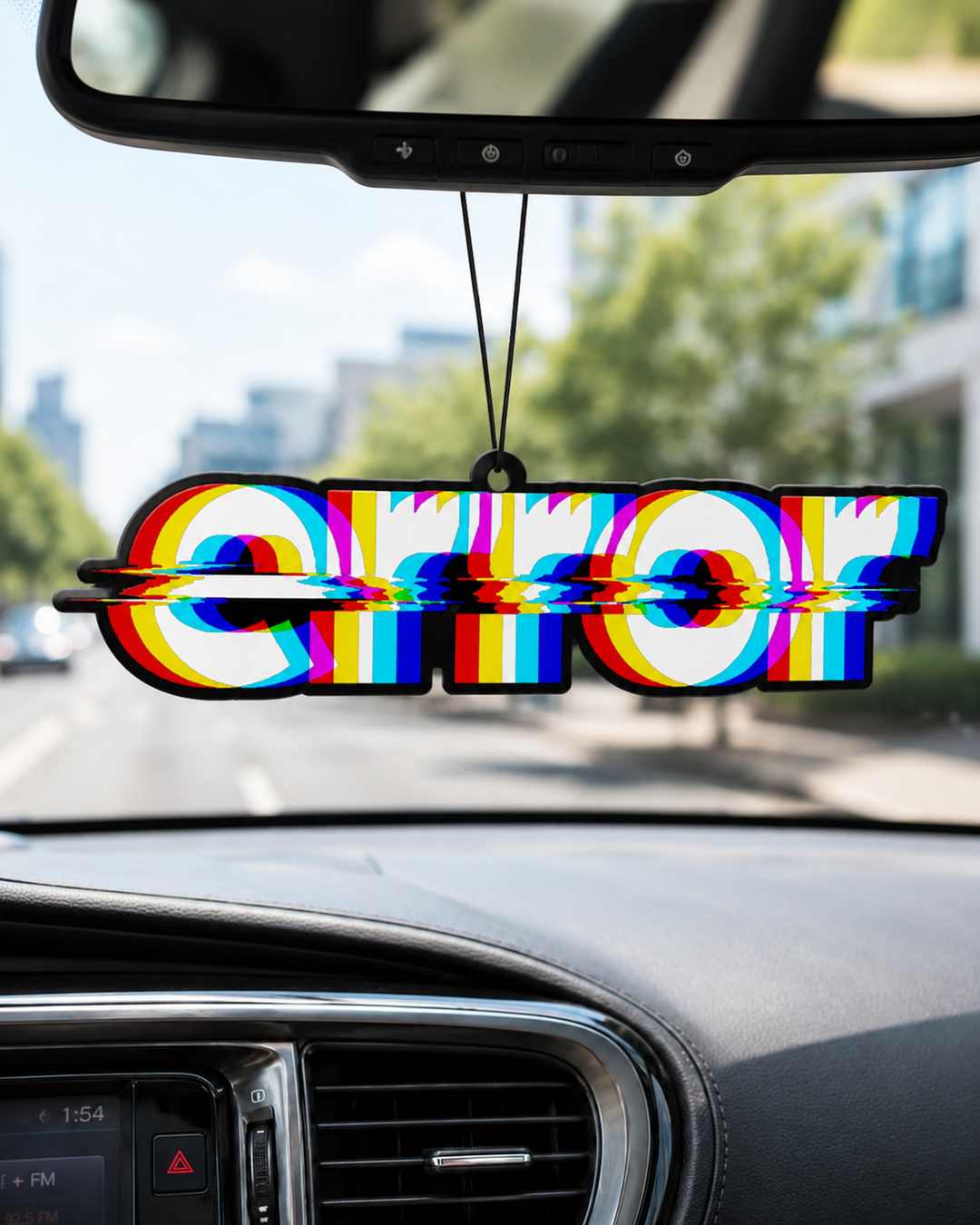 A car air freshener featuring the word 'ERROR' in bold letters with a colorful glitch effect, hanging from the rearview mirror inside a car.