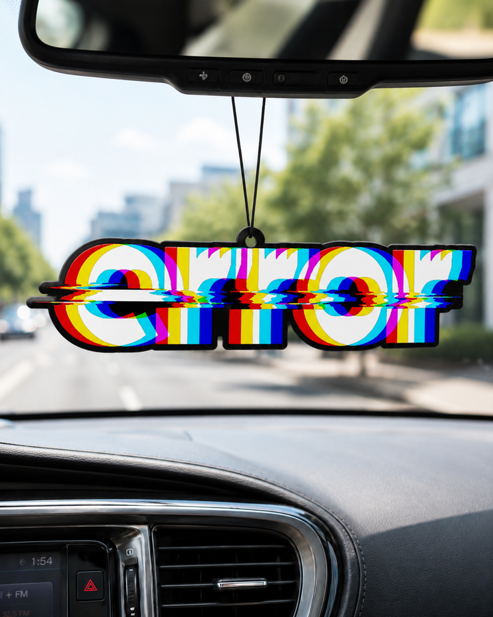 A car air freshener featuring the word 'ERROR' in bold letters with a colorful glitch effect, hanging from the rearview mirror inside a car.