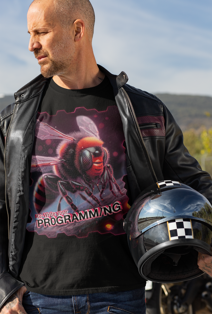 Man wearing a black t-shirt with a graphic design and text, holding a helmet outdoors.